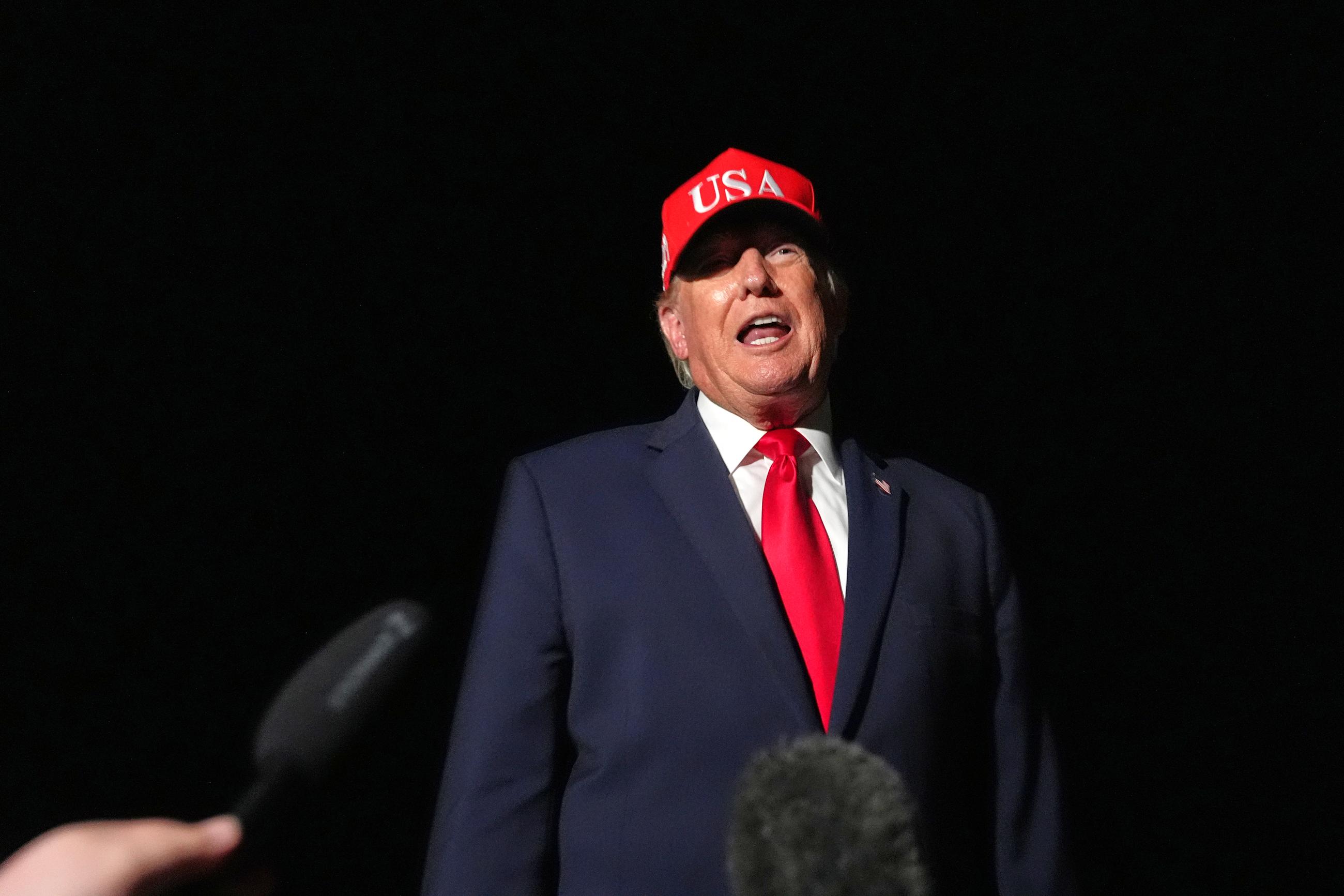 President Donald Trump talks with reporters before switching to the larger Air Force One at Missoula International Airport the trip back to Washington, Wednesday, Oct. 14, 2026, in Missoula, Mont. (AP Photo/Alex Brandon)