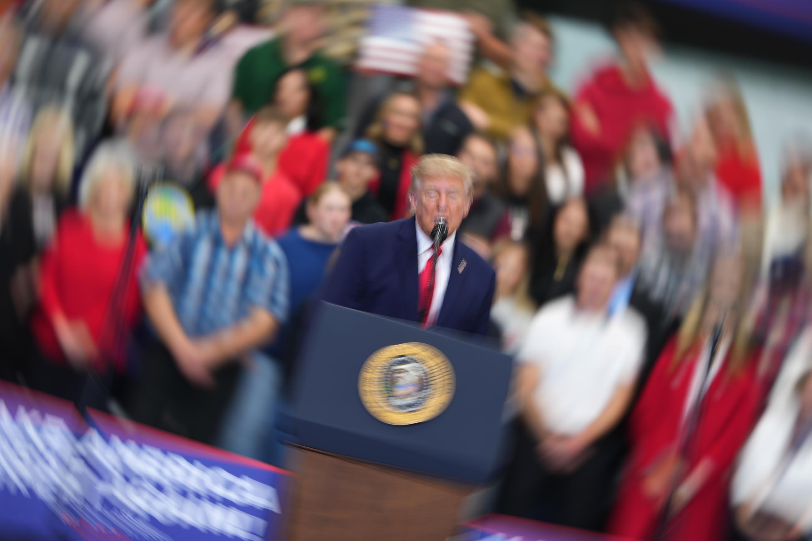 In this image made with long exposure, President Trump speaks at a campaign rally in Wasilla, Alaska, on Tuesday. (AP Photo/Lindsey Wasson)
