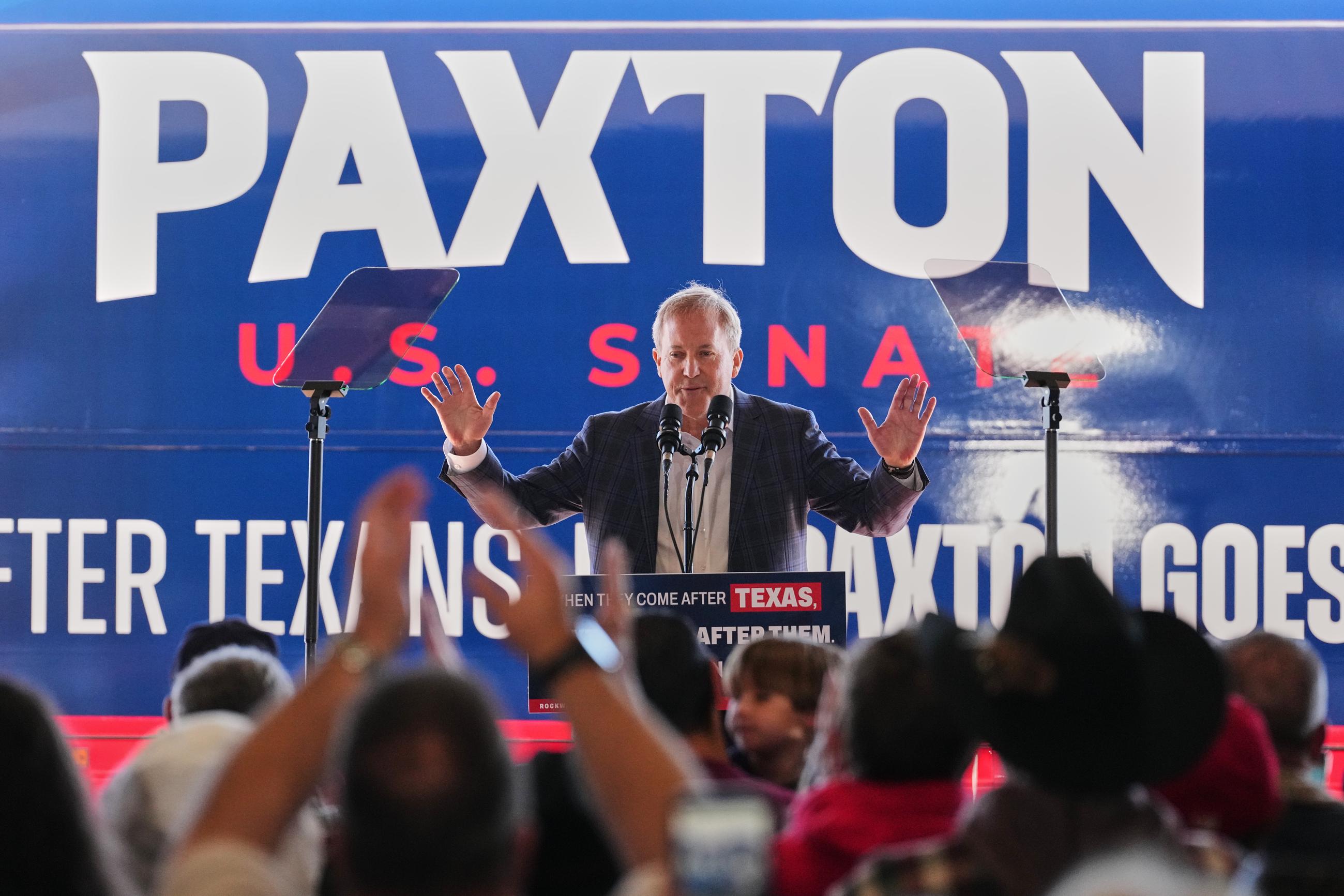 Republican U.S. Senate candidate Texas Attorney General Ken Paxton speaks to attendees as he kicks off his campaign's bus tour during an event at the Rockwall Municipal Airport Saturday, Oct. 17, 2026, in Rockwall, Texas. (AP Photo/Tony Gutierrez)