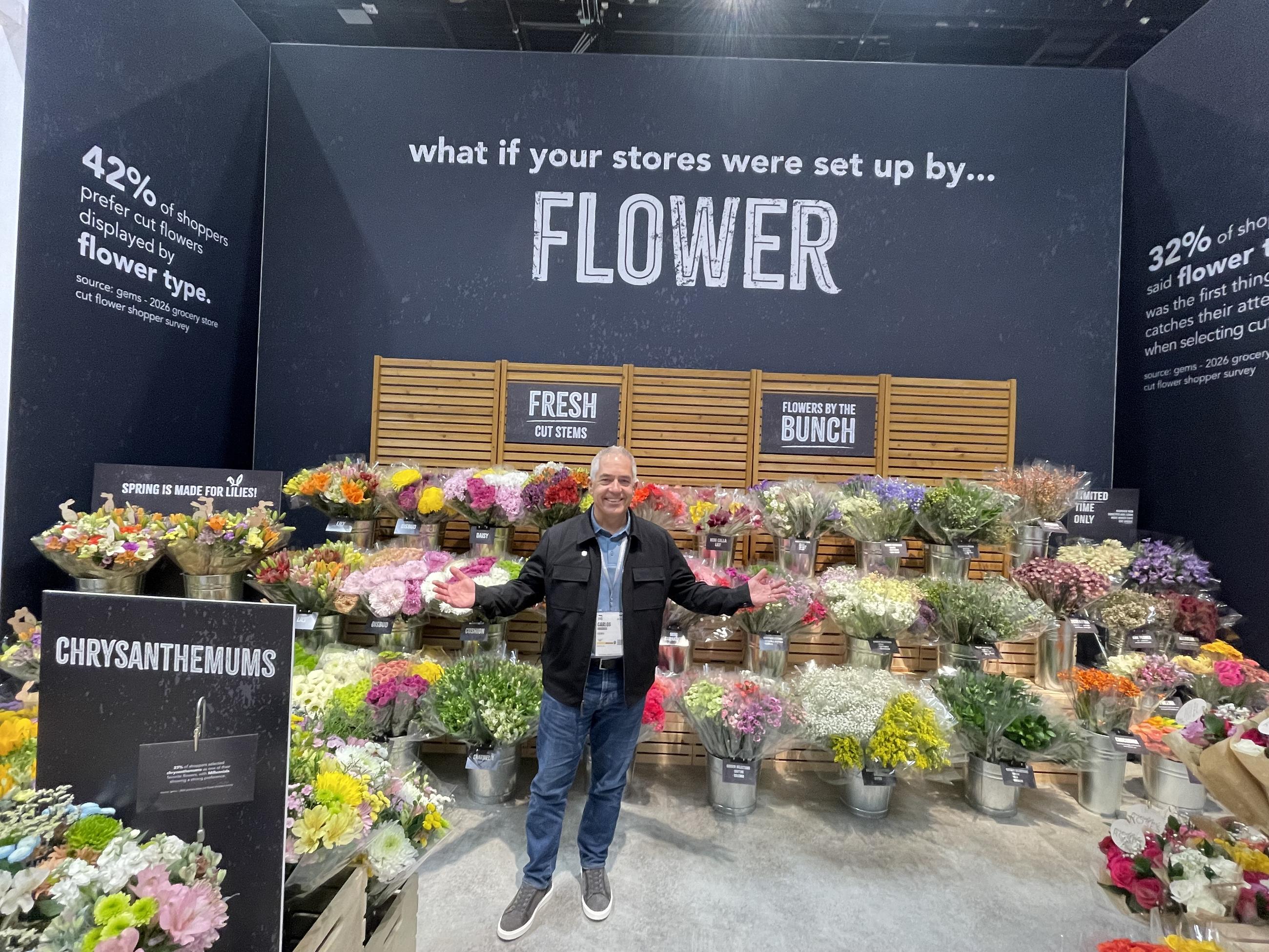 Carlos Oramas of the Miami-based Gems
group shows off the Colombian flowers he sells at the International Fresh Produce Association Global Produce and Floral Show in Orlando, Fla.