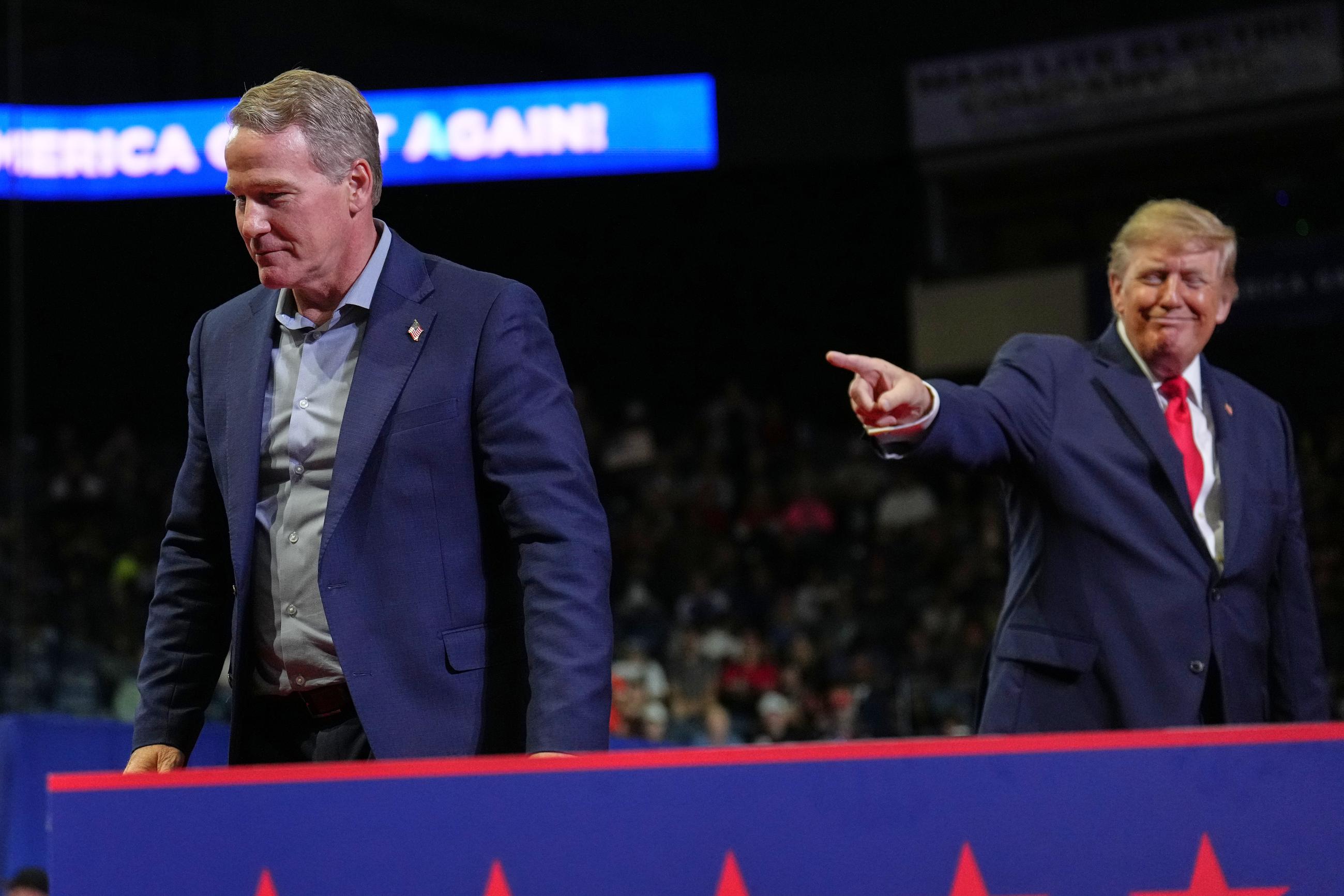 President Trump gestures after Sen. Jon Husted spoke at a campaign rally in Youngstown, Ohio, on Oct. 12. (AP Photo/Jacquelyn Martin)