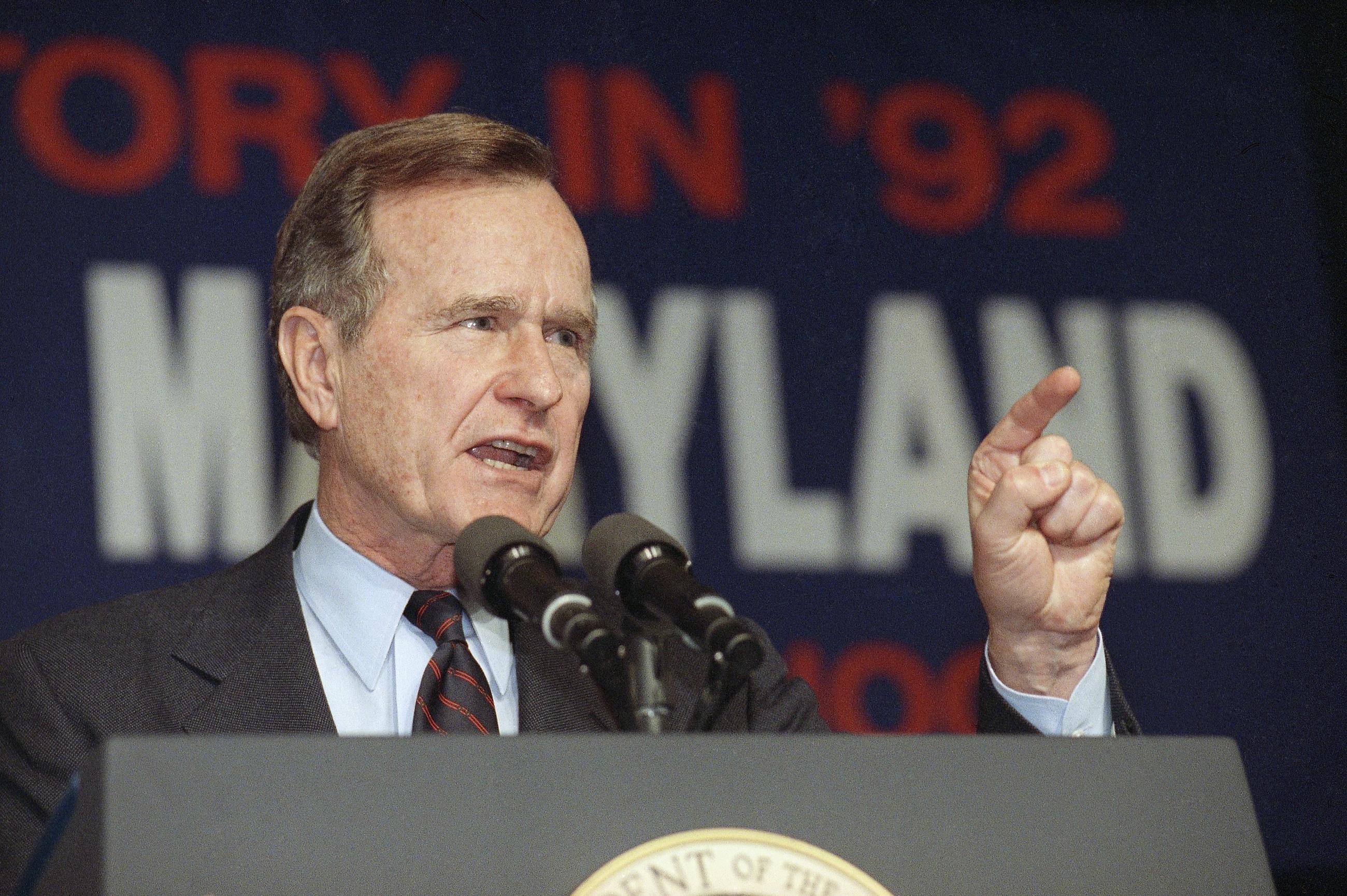 President George H.W. Bush speaks at a campaign rally in Maryland in February 1992. Bush pushed back against those "who say our economy has fallen into an abyss."  (AP Photo/ Dennis Cook)
